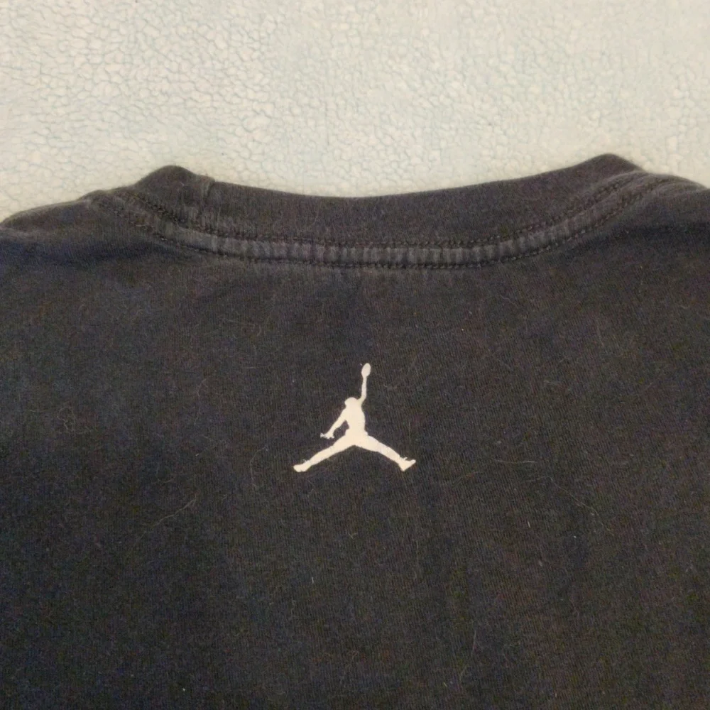 Jordan shirt with Chicago displayed in the middle